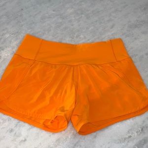 Lululemon speed up bright orange shorts NEVER WORN